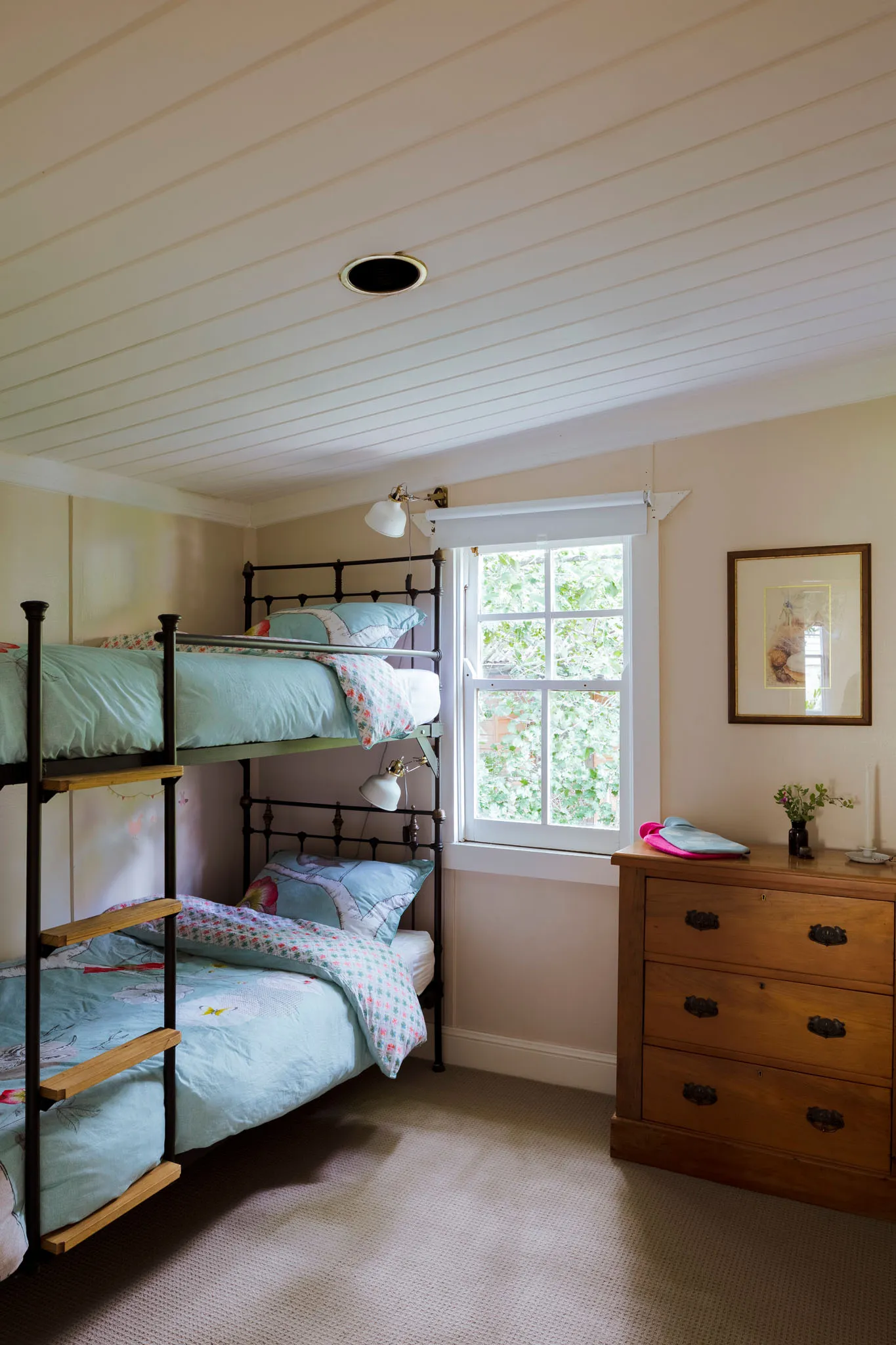 Bunk room with iron-framed bunk beds