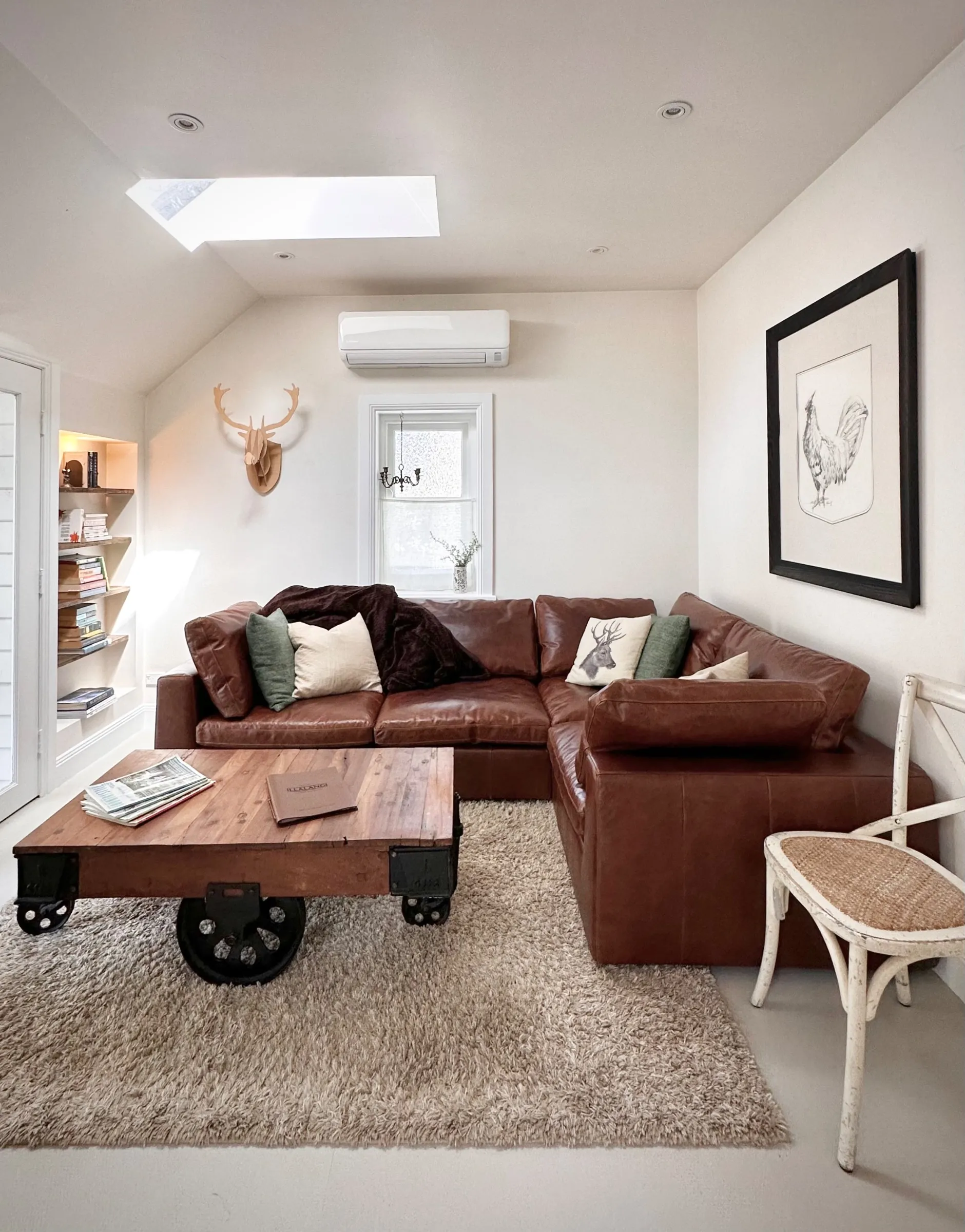 Comfy aged leather lounge with inviting decor