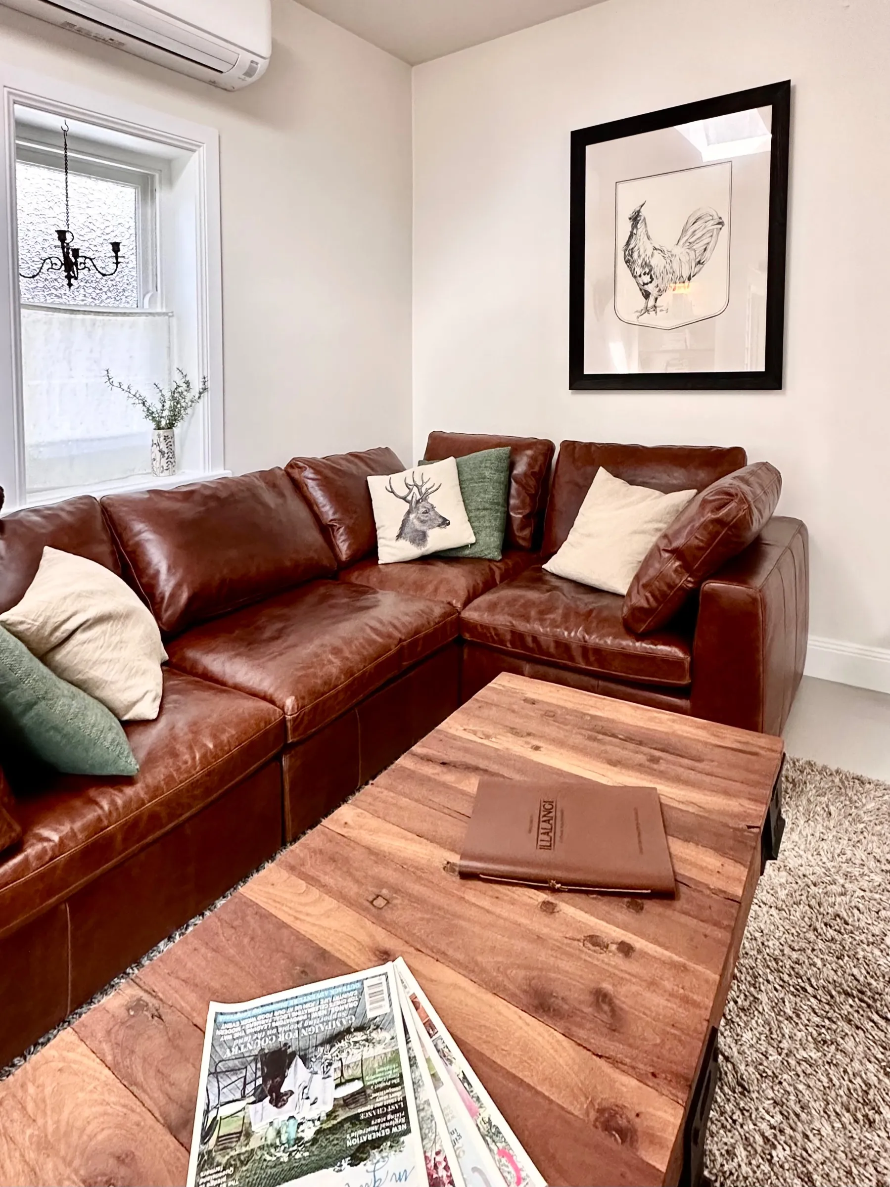 Cozy aged leather sofa and rustic coffee table